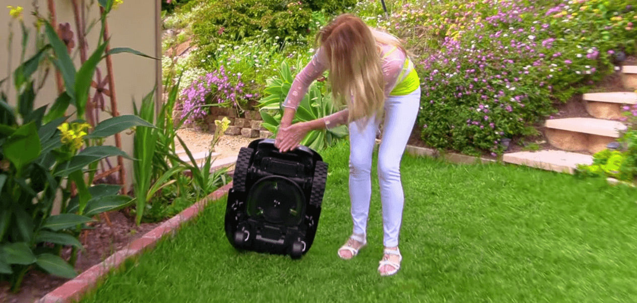 Explore the cutting-edge Sunseeker L22 robot lawn mower, showcased against a modern luxury home backdrop