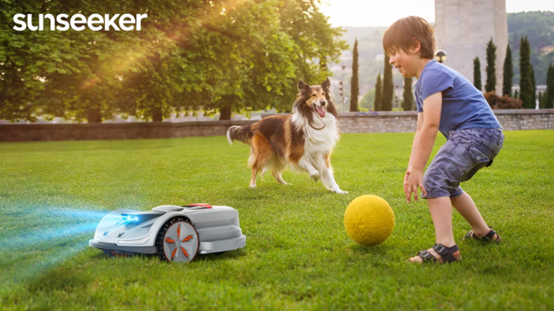 Sunseeker Orion X7 Series automated lawnmower is actively mowing the lawn, showcasing its obstacle avoidance and safety features for pets.